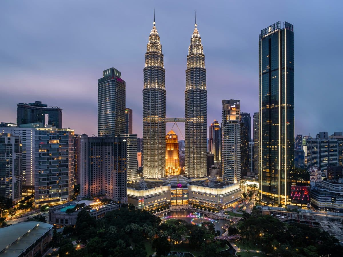 The Petronas Twin Towers on the Kuala Lumpur skyline at dusk